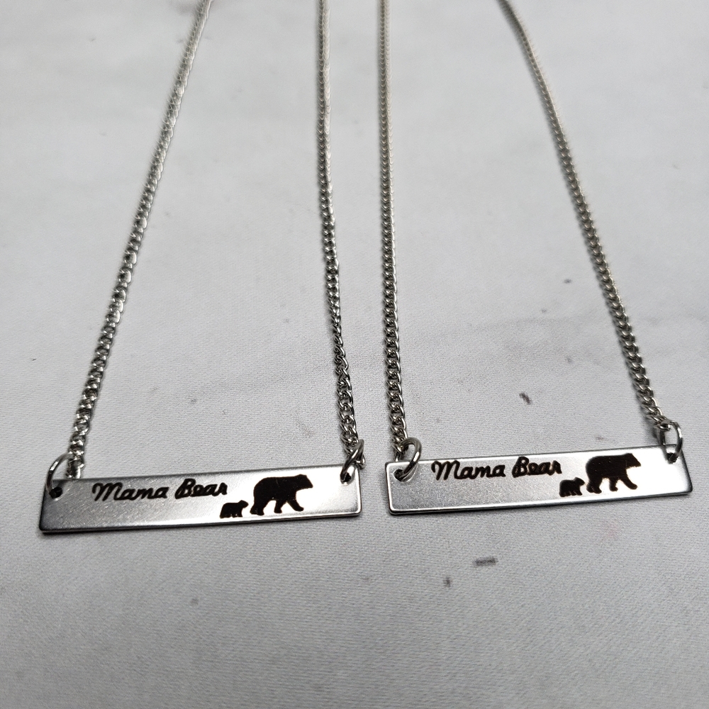 Mama bear silver colored necklace
